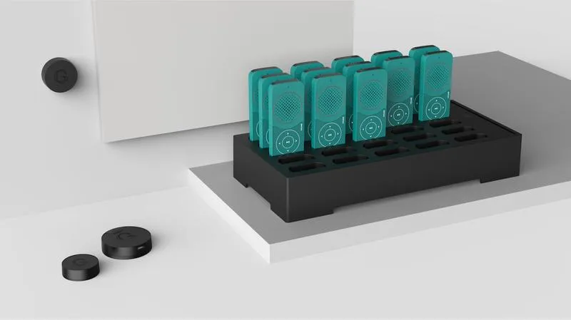Podcatcher Pro devices docked in a Basecamp, with Beacons in the foreground
