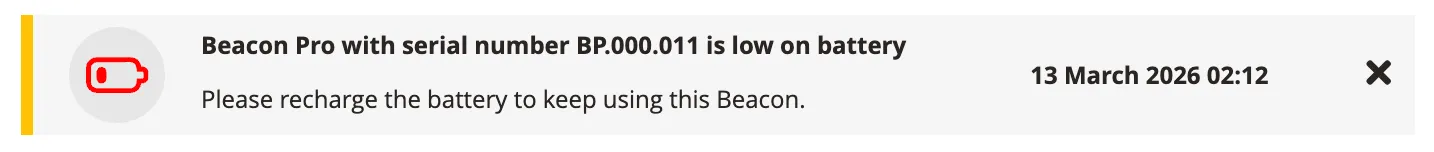Beacon Pro low battery notification — warns that BP.000.011 needs recharging.